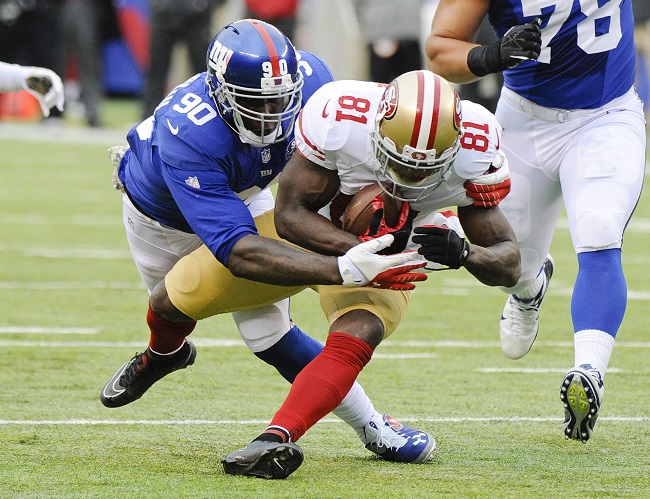 New York Giants defensive end Jason Pierre Paul tackles San Francisco 49ers wide receiver Anquan Boldin during the first half of an NFL football game Sunday Nov. 16 2014 in East Rutherford N.J