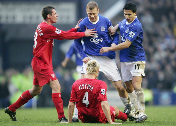 LIVERPOOL ENGLAND- DECEMBER 11 Sami Hyypia of Liverpool clashes with Duncan Ferguson of Everton during the Barclays Premiership match between Everton and Liverpool at Goodison Park