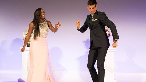 Wimbledon Champions Novak Djokovic of Serbia right and Serena Williams of the US dance on stage at the Wimbledon Champion dinner