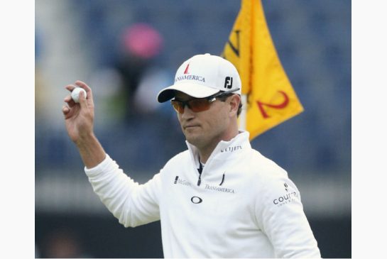 Zach Johnson holds up his ball after a birdie on the second hole during a playoff after the final round at the British Open Golf Championship at the Old Course St. Andrews Scotland Monday