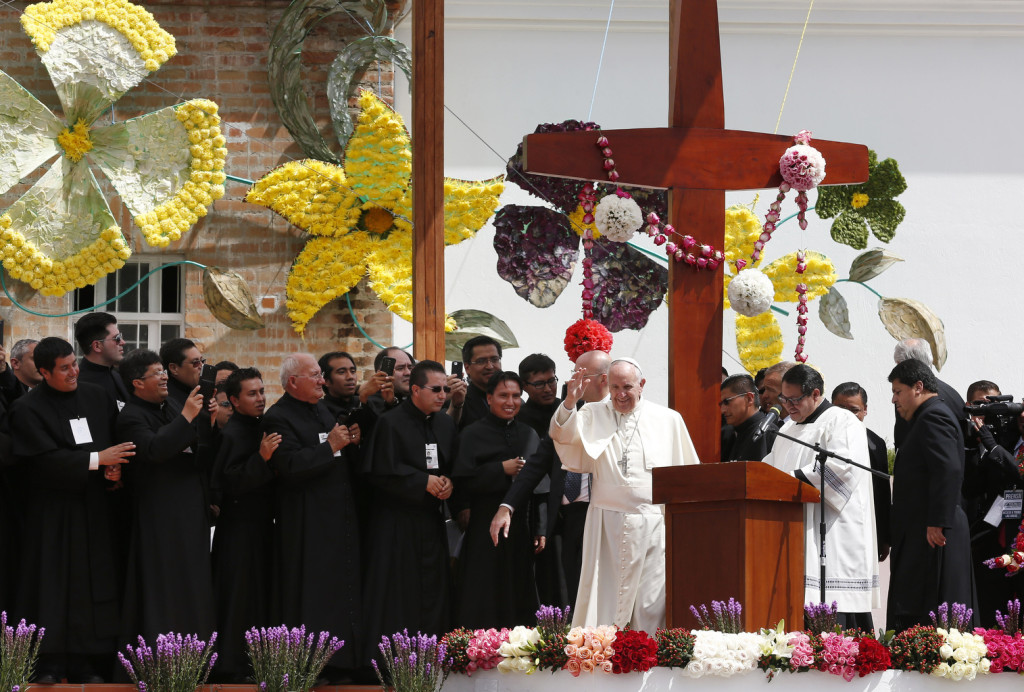 Pope Francis waves during a meeting with clergy religious men and women and seminarians at the El Quinche National Marian Shrine in Quito Ecuador July 8