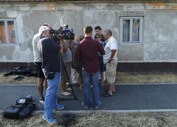 A family friend of Tomislav Salopek speaks to the media in Vrpolje village Croatia