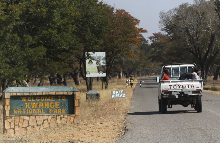 A vehicle carries visitors arriving at Zimbabwe's Hwange National Park. REUTERS  Philimon Bulawayo