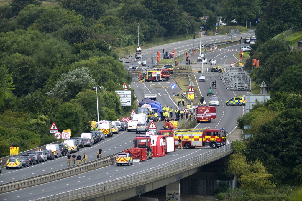 AFTERMATH Emergency services at the scene of the Shoreham air show crash which claimed the lives of at least 11 people