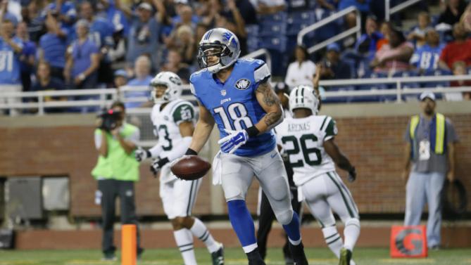 Detroit Lions wide receiver Greg Salas runs in the end zone after scoring on a 20-yard reception during the second half of an NFL preseason football game against the New York Jets Thursday Aug. 13 2015 in Detroit