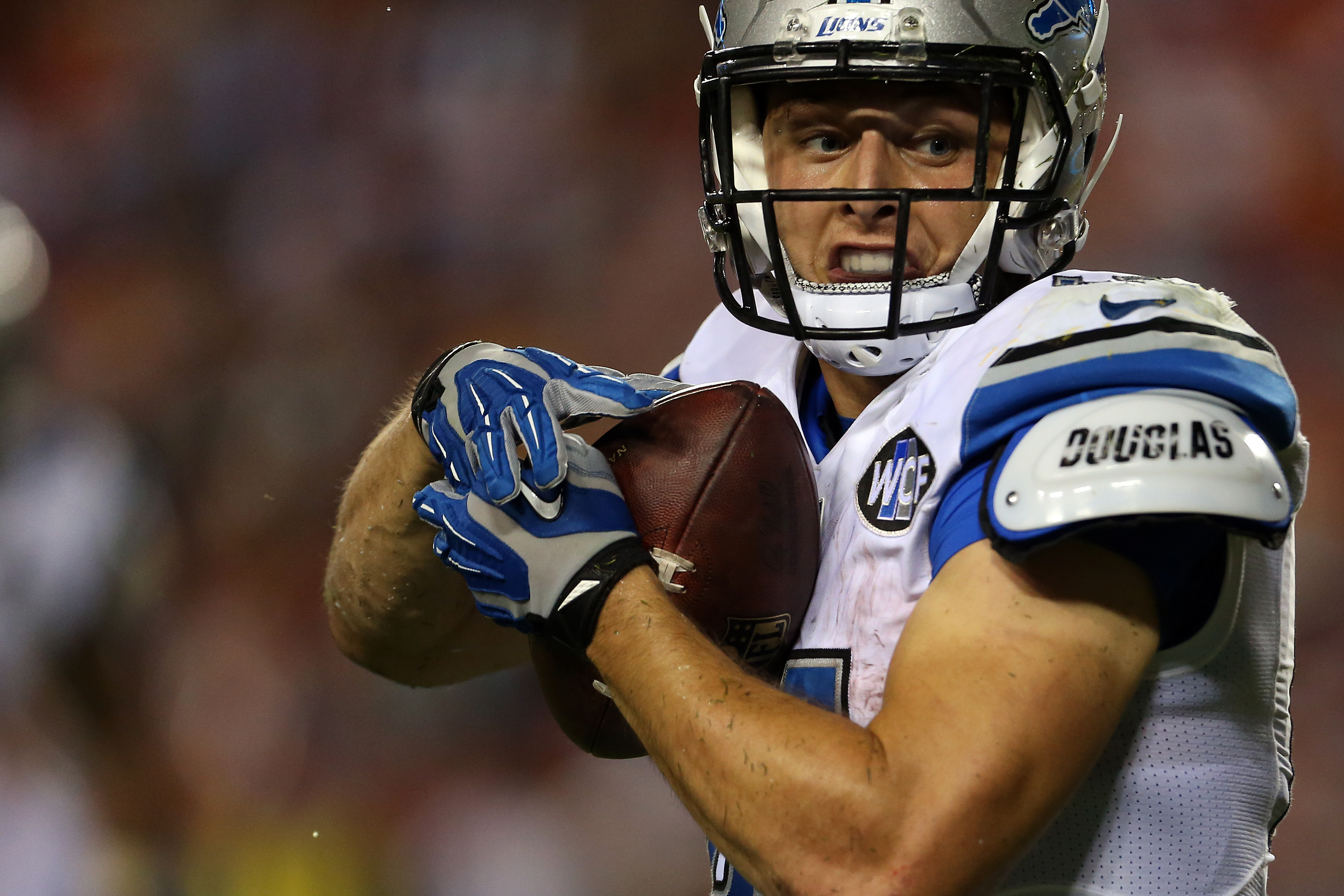 LANDOVER MD- AUGUST 20 Zach Zenner #41 of the Detroit Lions runs in for a touchdown during a preseason game against the Washington Redskins at Fed Ex Field