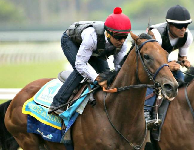 Triple Crown winner American Pharoah and jockey Martin Garcia appear during a workout at Del Mar Thoroughbred Club in Del Mar Calif