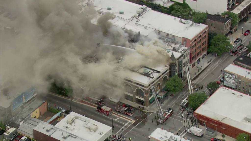 An extra-alarm fire burns in the Piper's Alley shopping center which includes at least one stage for the Second City comedy troupe