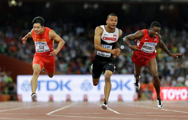 Canada's Andre De Grasse middle China's Su Bingtian left and United States&#039 Trayvon Bromell compete in a men’s 100m semifinal at the World Athletics Championships at the Bird's Nest stadium in Beijing Sunday Aug. 23 2015