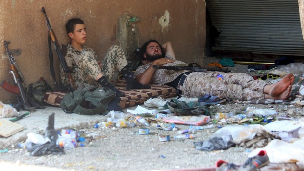 Fighters from a coalition of rebel groups called Jaish al-Fateh also known as Army of Fatah rest after clashes with forces loyal to Syria's President Bashar al Assad in the Hama countryside