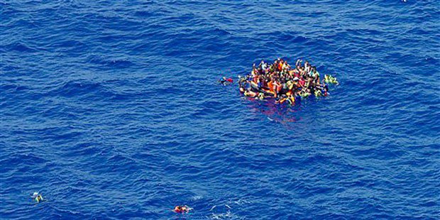 A migrant is carried on a stretcher after disembarking from the Italian Navy vessel 'Bettica&#039 in the harbor of Salerno Italy Tuesday