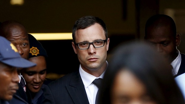 Paralympic track star Oscar Pistorius leaves after listening to the closing arguments in his murder trial at the high court in Pretoria in this