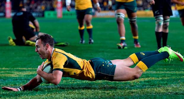 Australia's Nic White scores a try against the New Zealand All Blacks during the Bledisloe Cup