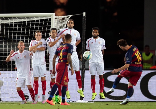 Barcelona’s Lionel Messi shoots a free kick