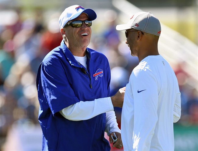 Buffalo Bills head coach Rex Ryan left smiles before the start of practice during an NFL football training camp in Rochester N.Y. Friday