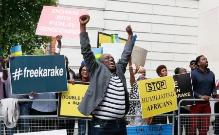 Protesters demanding the release of Rwanda's intelligence chief Karenzi Karake celebrate outside Westminster Magistrates Court after he was bailed for a bond of GB Pounds 1 Million in London Britain