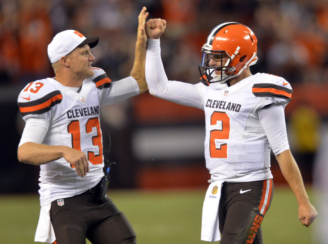 Cleveland Browns quarterback Josh Mc Cown congratulates Johnny Manziel after Manziel threw a 21yard touchdown pass to Shane Wynn during the fourth quarter of an NFL preseason football game against the Buffalo Bills