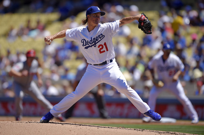 Los Angeles Dodgers starting pitcher Zack Greinke throws to the plate during the second inning of a baseball game against the Cincinnati Reds Sunday Aug. 16 2015 in Los Angeles