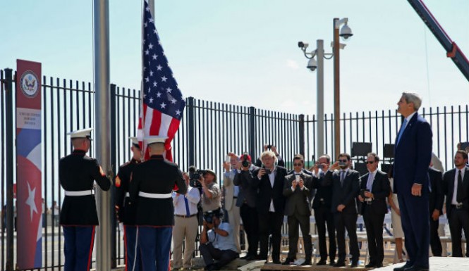 Secretary of State John Kerry stood with other dignitaries as members of the Marines raised the US flag over the newly reopened embassy in Havana Cuba on Friday