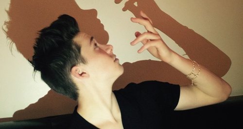 Brooklyn Beckham making a shadow puppet