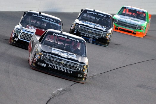 The No. 00 JR Motorsports Chevrolet leads a pack of trucks during a NASCAR Camping World Truck Series race at Iowa Speedway earlier this season