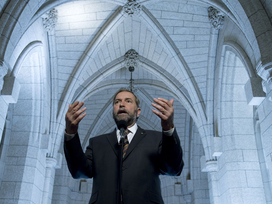 NDP leader Thomas Mulcair speaks with the media following a party caucus meeting on Parliament Hill