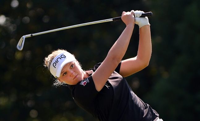 Brooke M. Henderson of Canada hits her tee shot on the second hole during the final round of the Cambia Portland Classic golf tournament in Portland Ore. Sunday Aug. 16 2015. Henderson believes the time she spent between the pipes growing up can giv