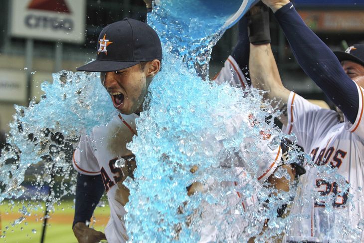 Carlos Correa with a postgame shower after his walk-off hit- Troy Taormina-USA TODAY Sports