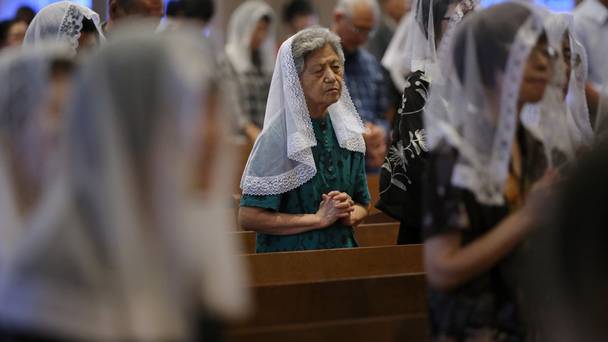 Catholics offer prayers at an early morning mass at the Urakami Cathedra to pay respect to the victims of the Nagasaki atomic bombing