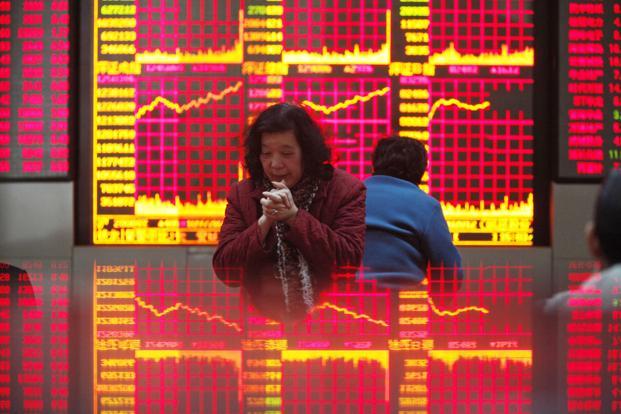 The Shanghai Composite Index traded little changed while the Hang Seng China Enterprises Index of mainland stocks traded in Hong Kong fell 1