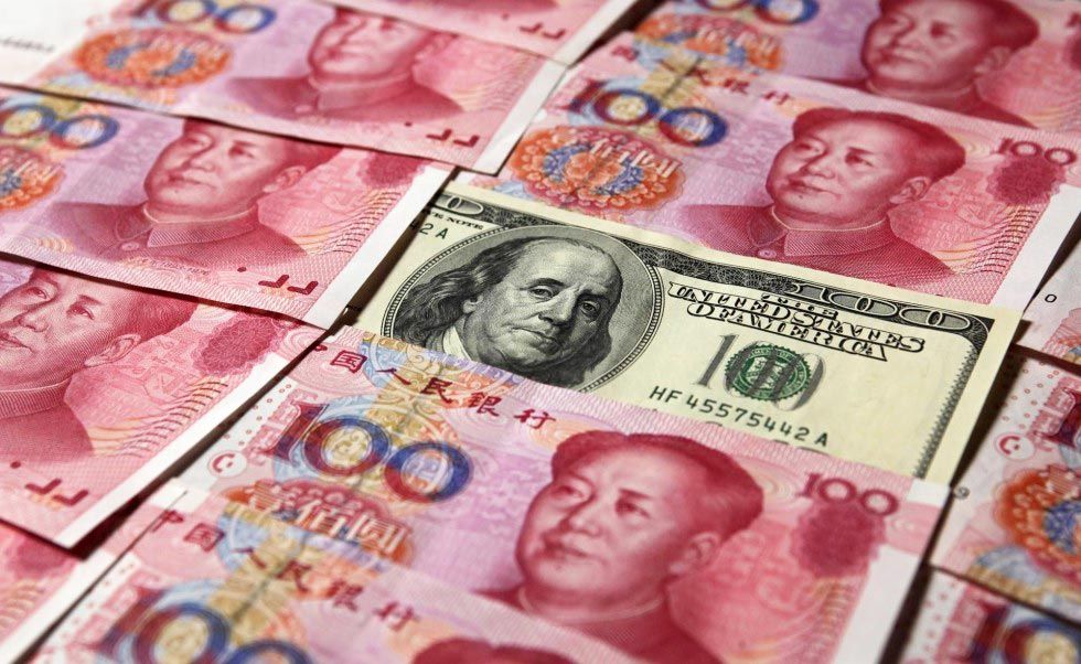 Associated Press A bank clerk counts Chinese currency notes Aug. 11 at a bank outlet in Huaibei in central China's Anhui province. China’s surprise move on Tuesday to devalue its currency has intensified concerns about a slowdown in the world’s sec