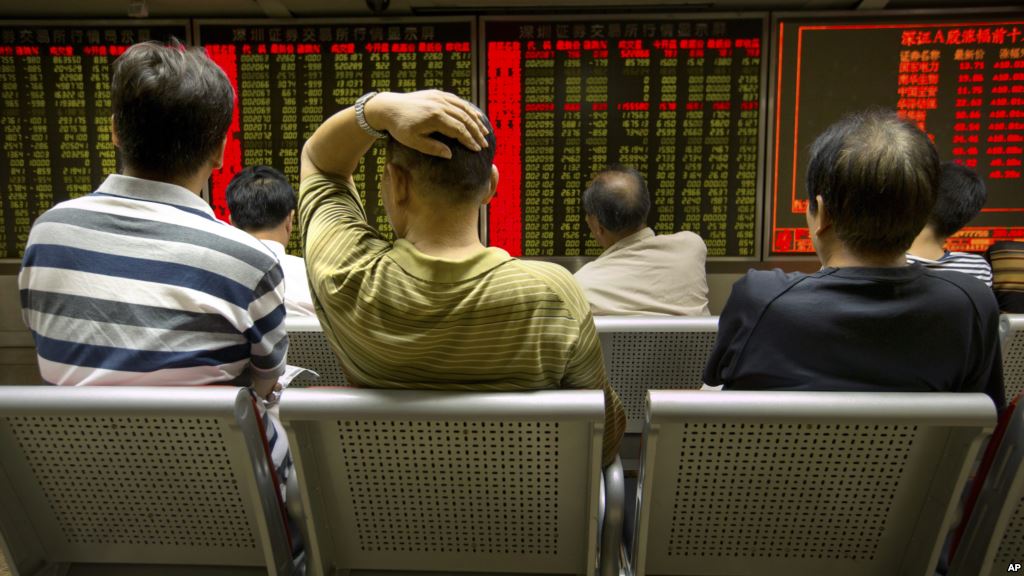 Chinese investors monitor stock prices at a brokerage house in Beijing Aug. 18 2015