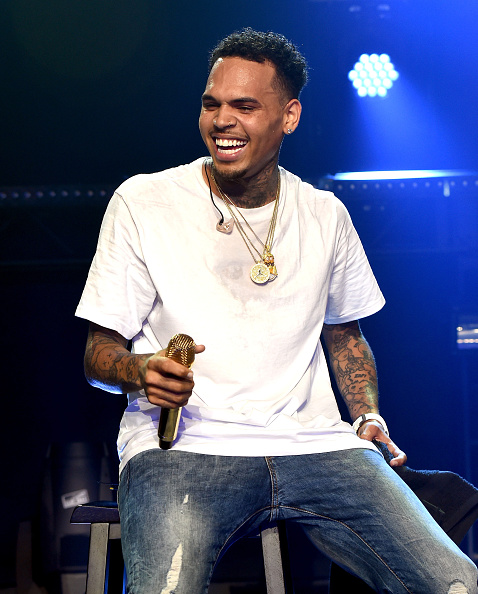 Chris Brown speaks onstage at the iHeartRadio Theater Los Angeles