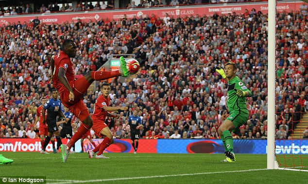 Christian Benteke pokes the ball past Bournemouth goalkeeper Artur Boruc to give Liverpool a 10 victory