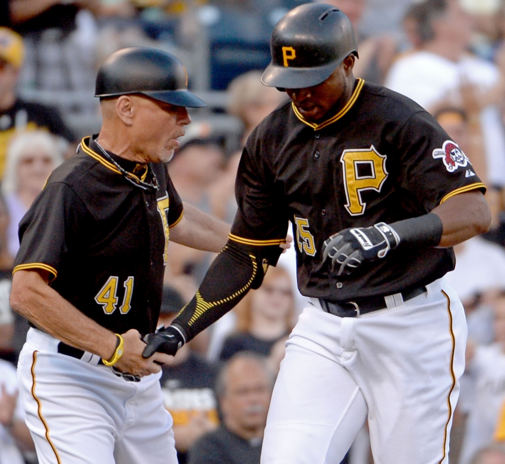 20150805mfbucssports04-3 Pirates third base coach Rick Sofield congratulates Gregory Polanco after hitting a home run against the Cubs in the first inning