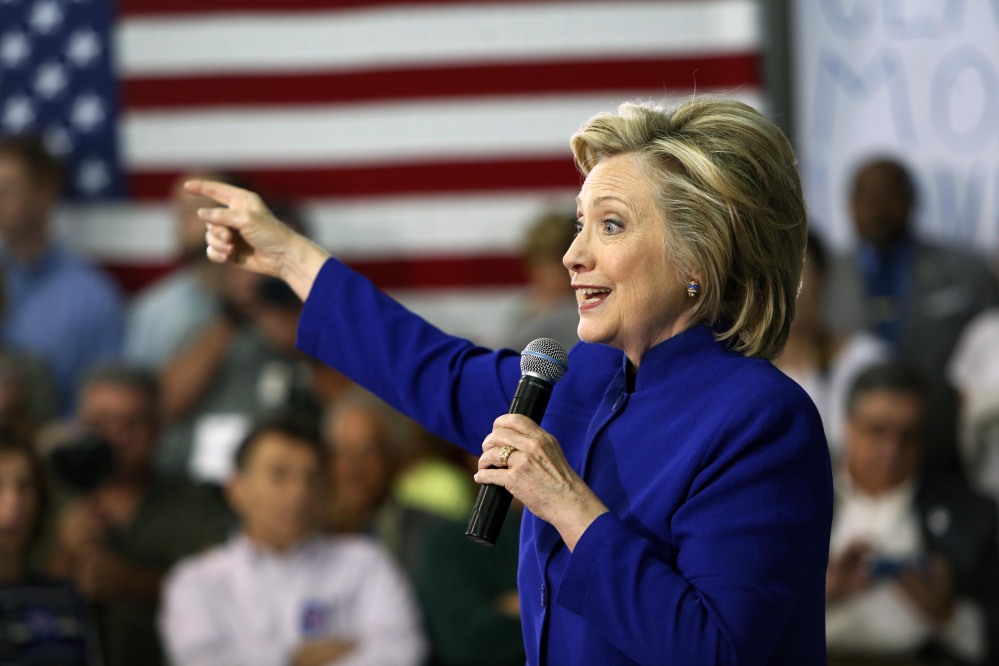 Hillary Clinton seen speaking during a campaign stop Tuesday at River Valley Community College in Claremont N.H. has “pledged to cooperate with the government’s security inquiry” into her private email account according to her campaign spokesman