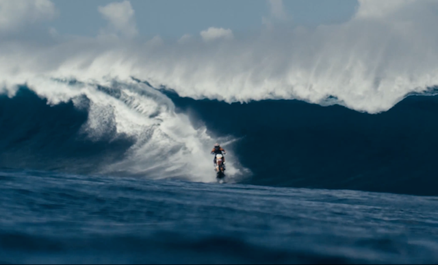 Robbie Maddison rides waves on a dirt bike