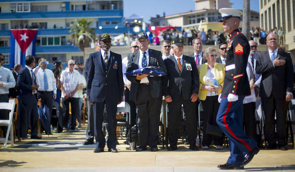 Retired Marines Gunnery Sgt. Francis'Mike East Gunnery Sgt. James Tracy and Cpl. Larry Morris wait to present the U.S. flag to current Marines. The three men were among the contingent that lowered the flag in 1961