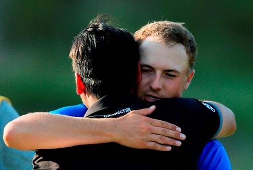 Jordan Spieth of the United States greets Jason Day of Australia after Day's threestroke victory at the 2015 PGA Championship at Whistling Straits