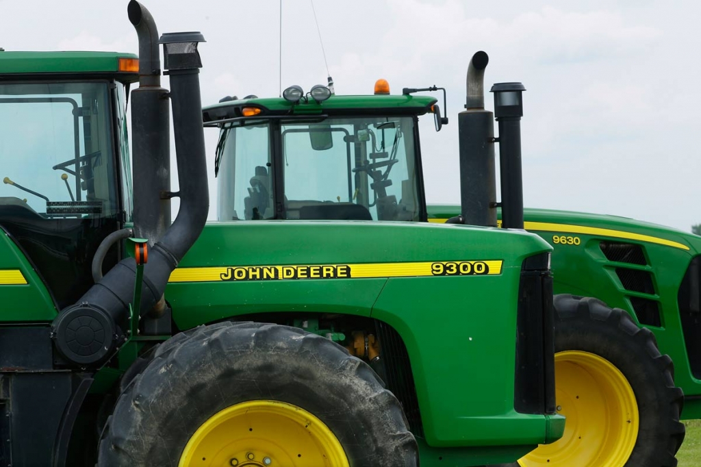 John Deere farming equipment on display for sale at a dealership in Petersburg Ill Deere and Co