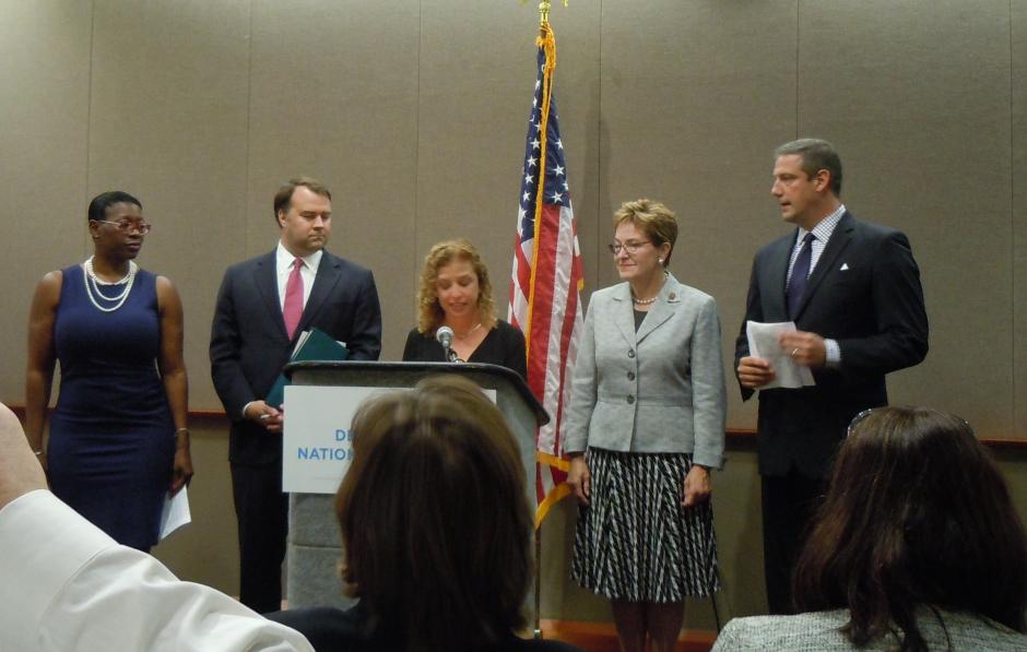 U.S. Rep. Marcy Kaptur and U.S. Rep. Tim Ryan right listen as Debbie Wasserman Schultz chairwoman of the Democratic National Committee speaks at a Thursday press conference in downtown Cleveland