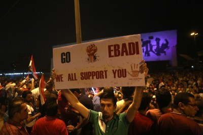 Demonstrators rally in Baghdad on Sunday in support of Iraqi Prime Minister Haider al-Abadi’s anti-corruption initiative