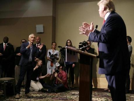 Miami-based Univision anchor Jorge Ramos left asks Republican presidential candidate Donald Trump a question about his immigration proposal during a news conference on Tuesday