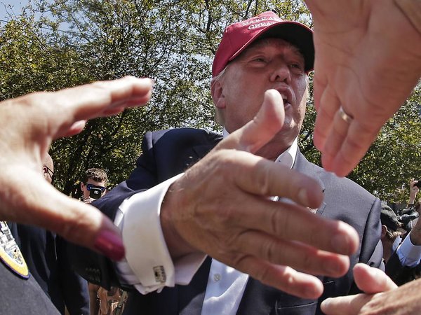 Republican presidential candidate Donald Trump greats the crowd at the Iowa State Fair Saturday Aug. 15 2015 in Des Moines