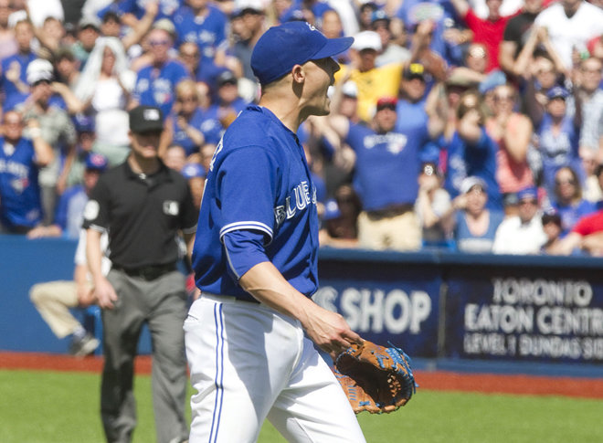 Toronto Blue Jays pitcher Aaron Sanchez reacts after being ejected from a baseball game against the Kansas City Royals for throwing at Royals batter Alcides Escobar in the eighth inning in Toronto Sunday Aug. 2 2015. (Fred Thornhill  The Canadian Press