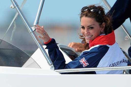 Catherine Duchess of Cambridge waves to a british competitor during the Women's Laser Radials race on Day 10 of the London 2012 Olympic Games at the Weymouth & Portland Venue at Weymouth Harbour