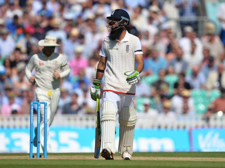 England's Moeen Ali walks off the pitch after being caught out