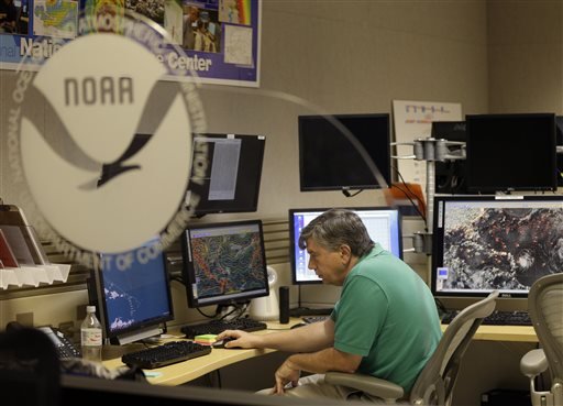 Jack Beven senior hurricane specialist tracks the movement of Tropical Storm Erika as it moves westward towards islands in the eastern Caribbean at the National Hurricane Center Wednesday Aug. 26 2015 in Miami. Tropical storm warnings have been iss