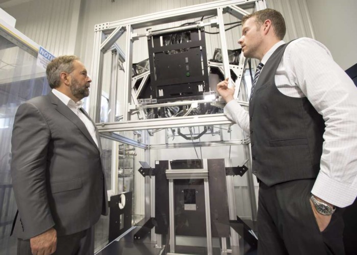 NDP Leader Tom Mulcair tours Sciencetech Inc. with company president Scott Hafekost right in London Ontario. on Wednesday Aug. 26 2015.  MANDATORY CREDIT