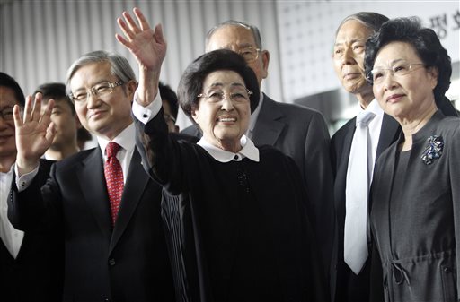 Lee Hee-ho center the wife of late former South Korean President Kim Dae-jung waves as she arrives at Gimpo Airport in Seoul South Korea to leave for North Korea Wednesday Aug. 5 2015. Lee's planned Aug. 5-8 trip comes amid continuing animosity